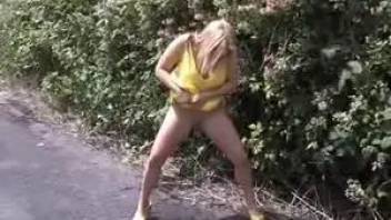 Girl pees on the sidewalk