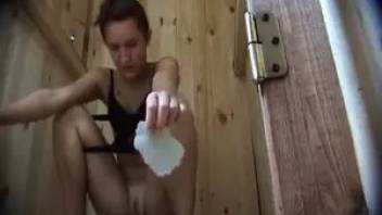 Girl poops in a wooden toilet. Hidden camera.